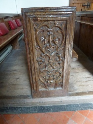 Carving on the end of the pew in Stogursey Church.