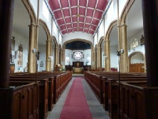 The aisle and altar in St Andrew's Church. 