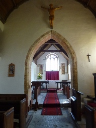 The aisle and altar in Podimore Church.