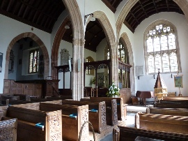 Pews and archways in the Church of the Holy Ghost, Crowcombe.
